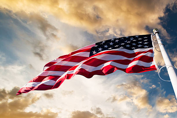 american flag in the sky american flag waving  blue sky circa 4th century stock pictures, royalty-free photos & images