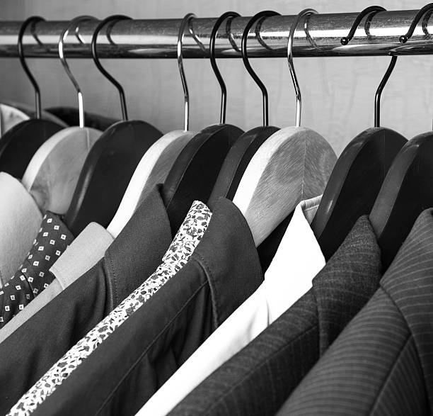 istock shirts and jackets in wardrobe isolated closeup 512700234