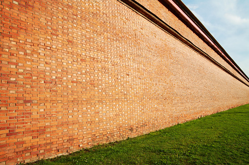 Brick wall in perspective, receding into the distance