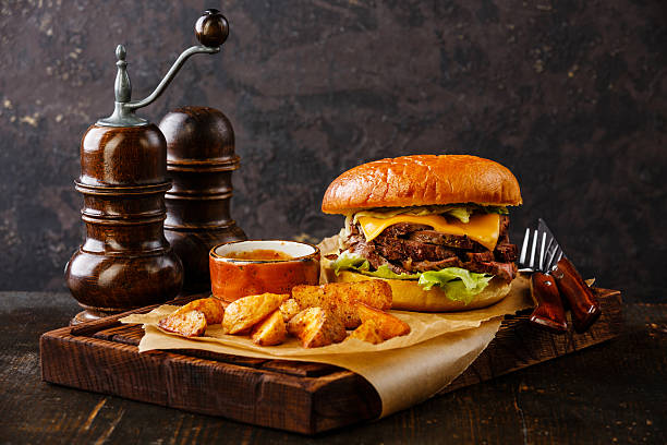 istock Pastrami Burger with sliced Roast beef and potato wedges 512701430