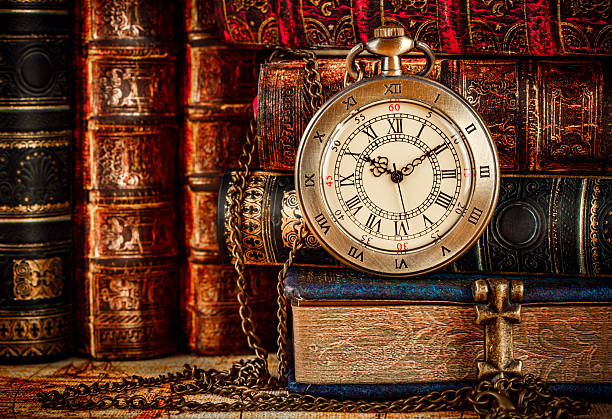 istock Old Books and Vintage pocket watch 512703858