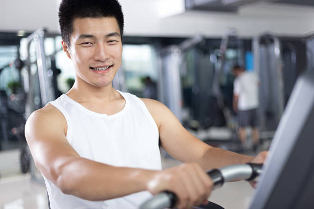 istock young handsome man working out in modern gym 512704424
