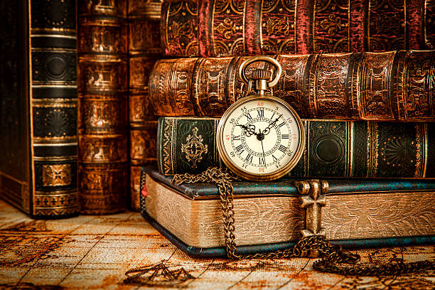 istock Old Books and Vintage pocket watch 512704428