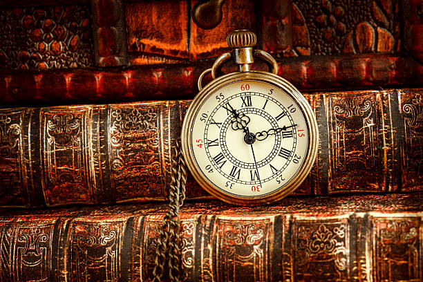 istock Old Books and Vintage pocket watch 512704690