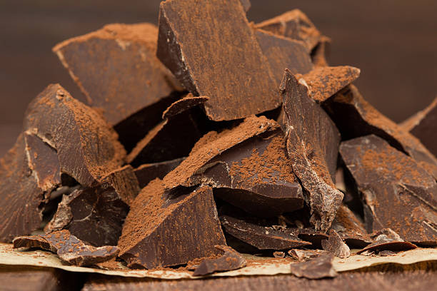 istock Dark chocolate with cacao on wooden table 512730356