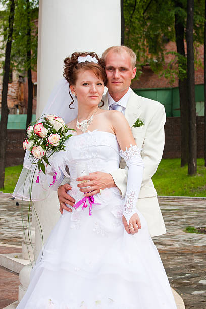 istock groom and fiancee on a walk in a park 512731284