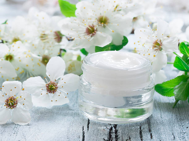 istock natural facial cream with spring flowers 512733124