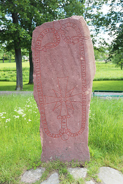 Runic inscriptions on a runestone Runic inscriptions on a runestone in Mariefred, Sweden mariefred stock pictures, royalty-free photos & images