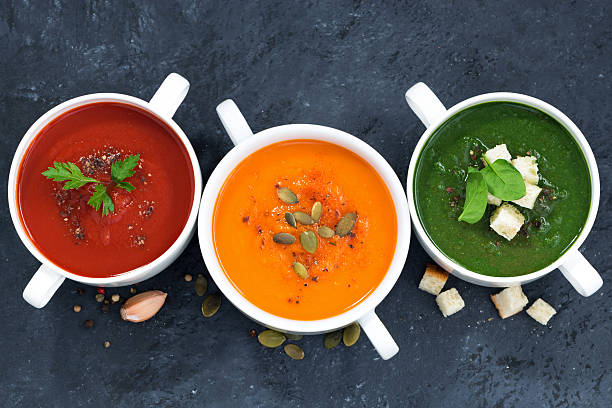 istock assortment of vegetable cream soup on a dark background 512736092