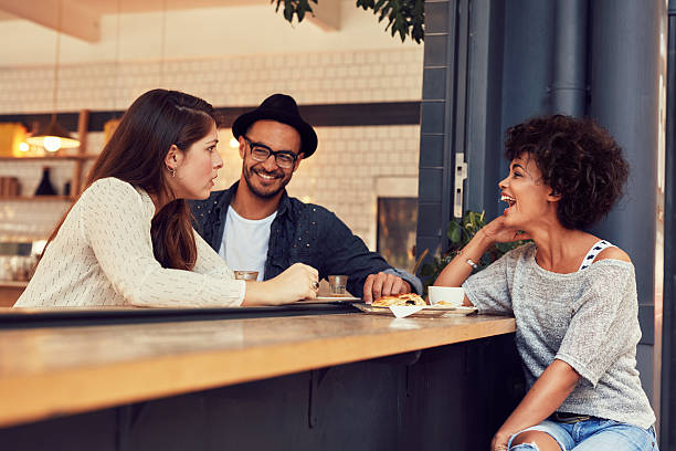 istock Group of friends talking in a cafe 512736414