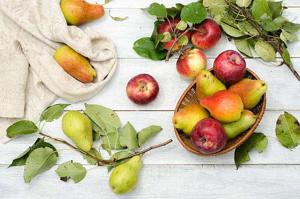 istock Apples and pears on a wooden table 512736454