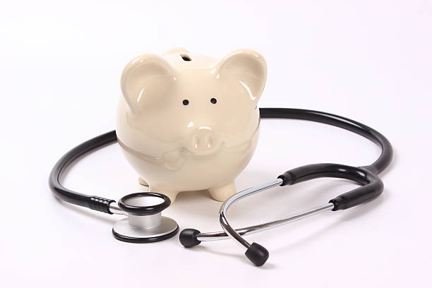 istock Piggy bank and stethoscope 512736522