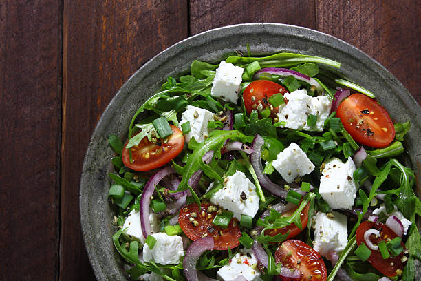istock Salad with arugula, tomato, cheese and red onion 512736898