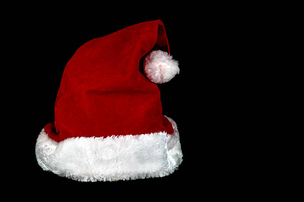 istock Christmas Santa Hat on a Black Background 512739648