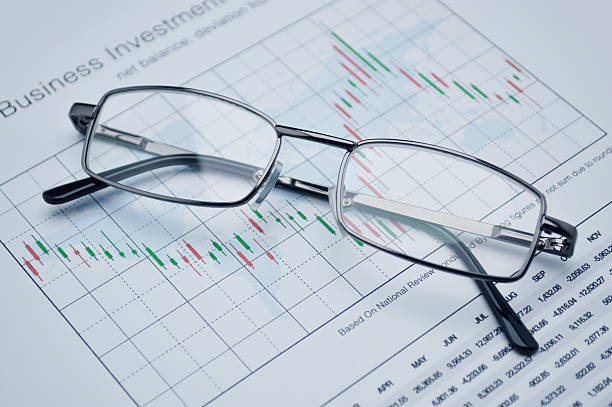 istock Glasses on stock market graph, financial concept 512740656