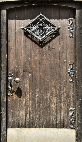 Old vintage rustical doors with metal handle.
