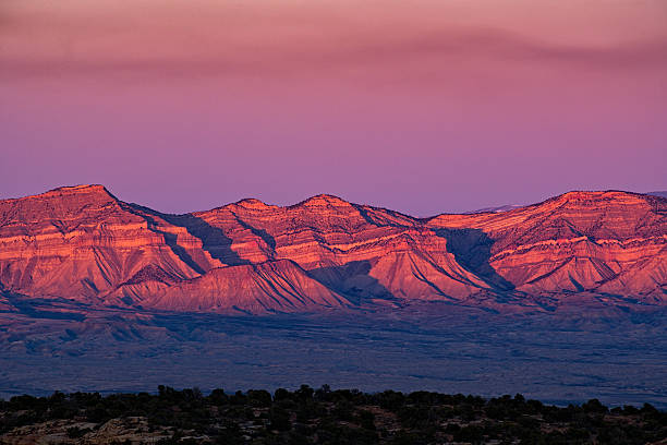 Book Cliffs Fruita Grand Junction Colorado Book Cliffs Fruita Grand Junction Colorado - Canyons and alpenglow scenic view of iconic Book Cliffs in the Grand Valley, Colorado USA. fruita colorado stock pictures, royalty-free photos & images