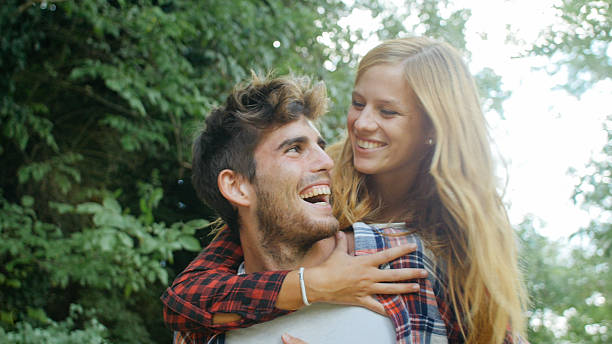 istock Couple having fun with piggyback ride 512744108