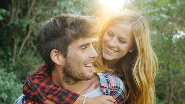 istock Couple having fun with piggyback ride 512744246