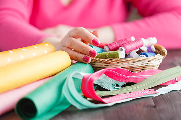 istock The woman is holding threads 512744696