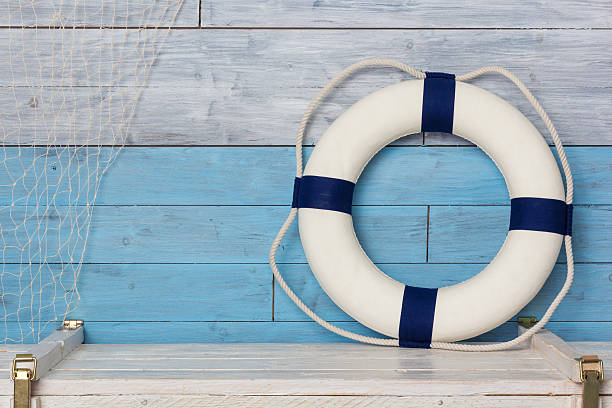 istock life buoy on wood background blue and white 512746066