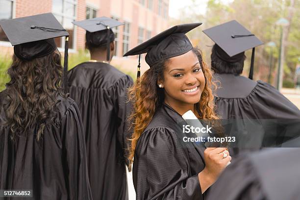 Education African Descent Female Graduate And Friends On College Campus Stock Photo - Download Image Now