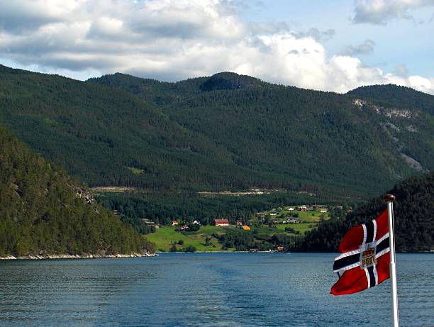 istock Norway fjords from a boat with flag 512747758