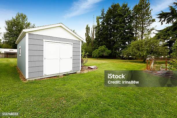 Small Grey Shed With White Trim Countryside Real Estate Stock Photo - Download Image Now