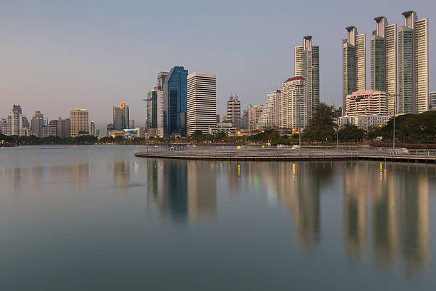 istock Reflection of Bangkok downtown office building during Twilight, Thailand 512748312