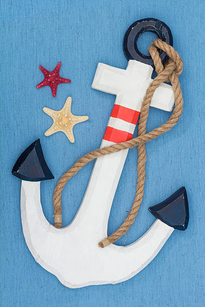 istock anchor and starfish on blue canvas 512748538