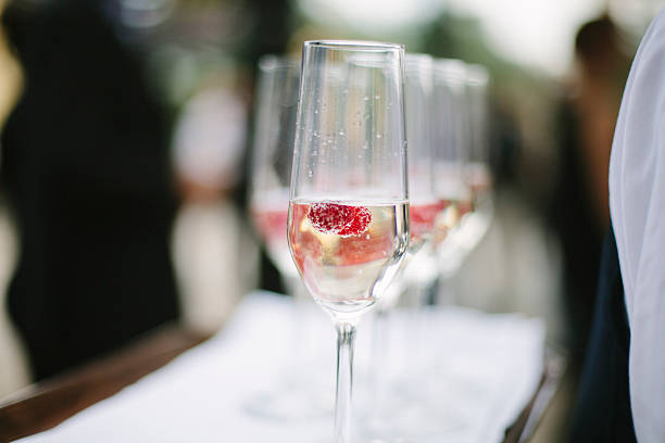 istock Glass of champagne with raspberry. 512748744