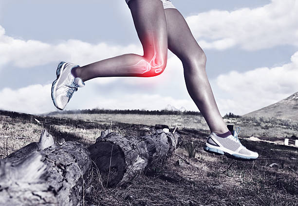 Taking on the trail one knee at a time A cropped view of a female jogger on a trail experiencing joint inflammation orthopedics photos stock pictures, royalty-free photos & images