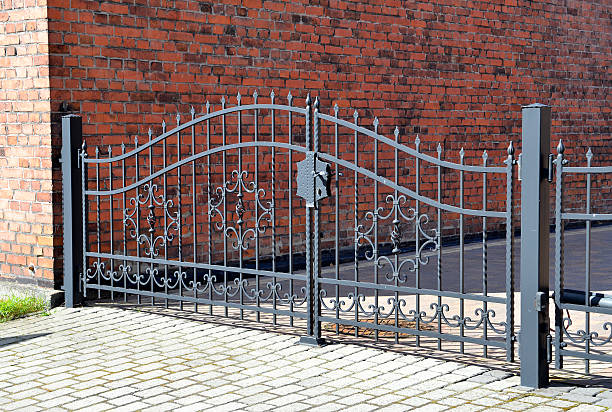 istock Forged iron gate outdoor, black grey fence. 512750055