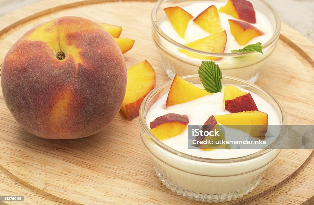 dairy product with peach yogurt with berries and fruits Breakfast Stock Photo