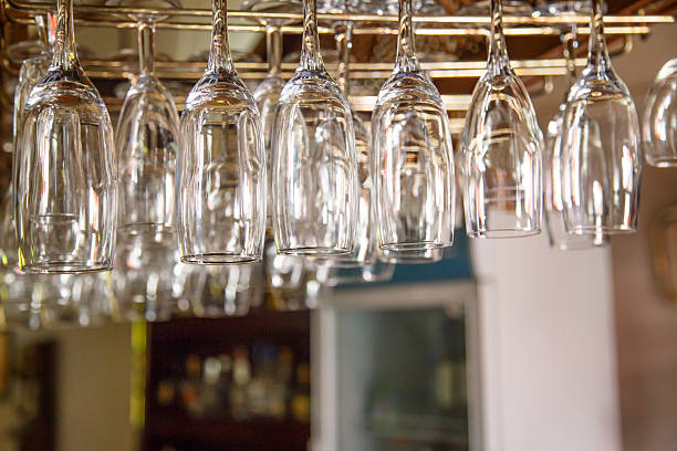istock Empty glasses hanging over in restaurant bar 512750470