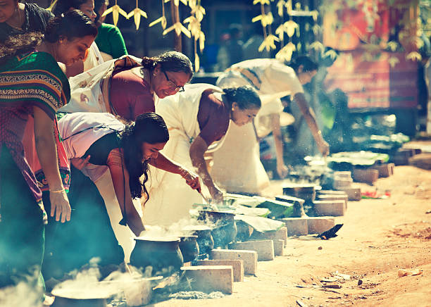 Varkala,Kerala state, India -January 25th, 2015: South India. Women cooking along the street which leading to the temple. Religious ceremony.
