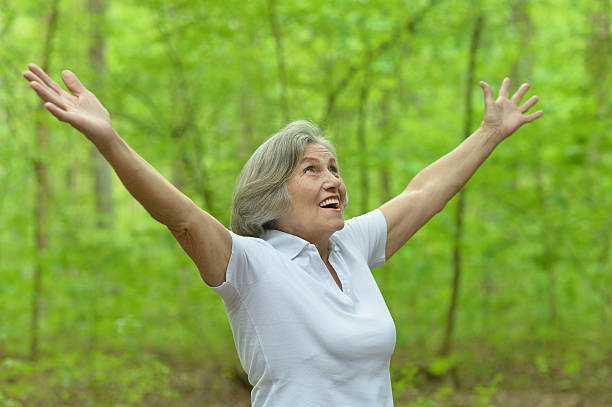 istock Senior woman in summer park 512751506