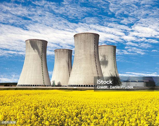 Nuclear Power Plant Dukovany With Golden Glowering Field Of Rapeseed Stock Photo - Download Image Now