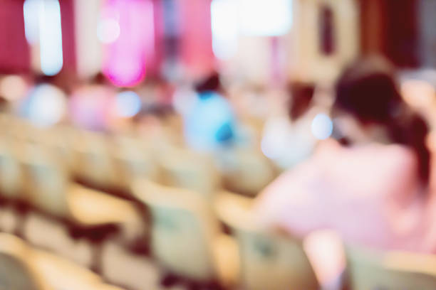 istock blur image of Parent looking at kids on school stage. 512751852