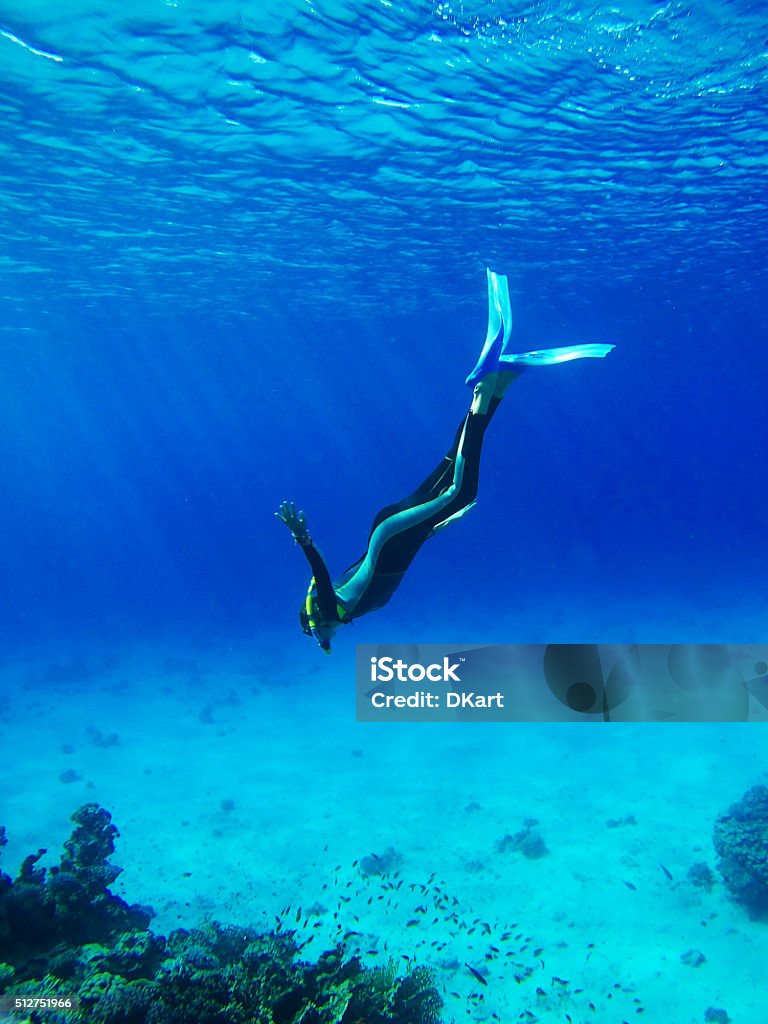 Diver in Deep Blue Sea Diver in Deep Blue Sea. Go pro camera shot Underwater Diving Stock Photo