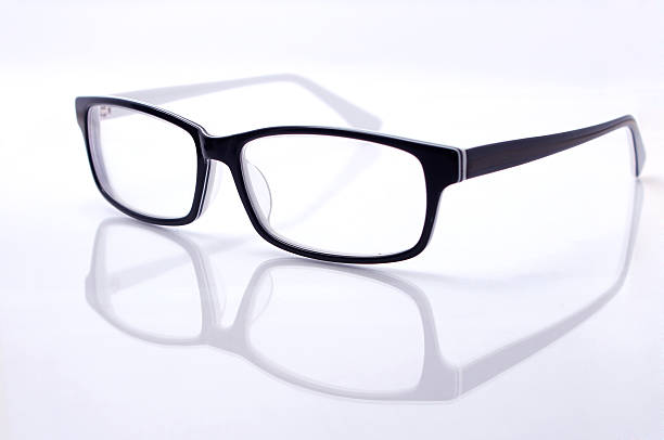 istock Seeing glasses on reflecting glass isolated on white background 512752078