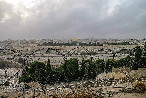 istock Panorama of Jerusalem with barbed wire in the foreground. Israel 512752386