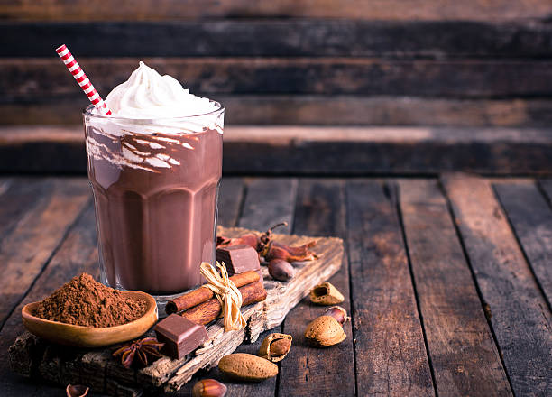Chocolate milkshake with whipped cream Chocolate milkshake with whipped cream  smoothie photos stock pictures, royalty-free photos & images