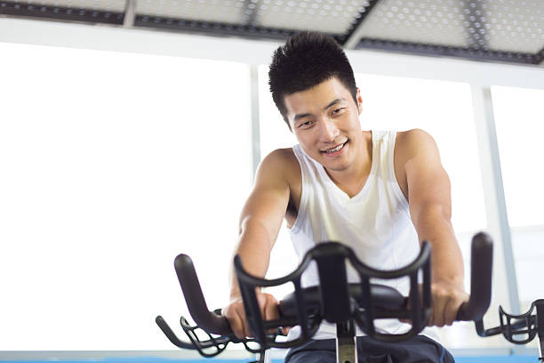 istock young handsome man working out in modern gym 512754470