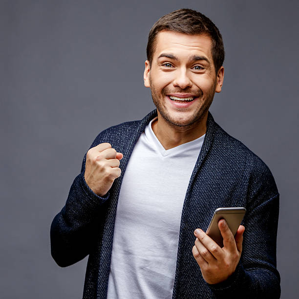 istock Cheerful young man in smart casual wear 512755278