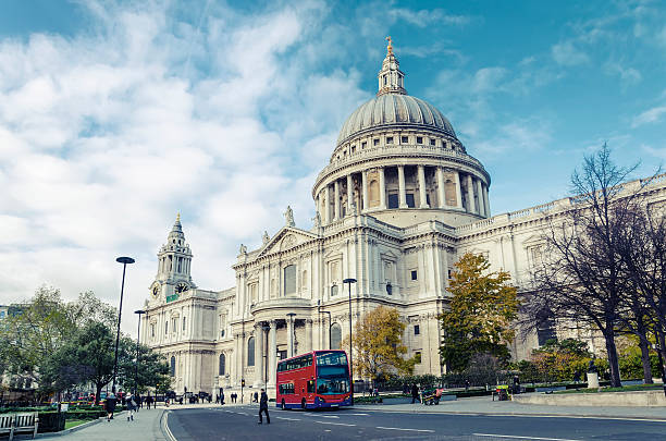 istock Red double decker bus at Saint Paul's Cathedral, London, vintage 512796501