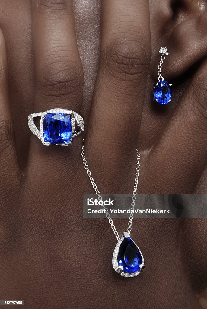 Tanzanite and Diamonds Designer Jewellery Tanzanite and Diamonds Designer Jewellery on the Skin of a Black Lady Jewelry Stock Photo