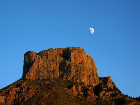 Casa Grande mountain in Big Bend National Park at sunrise with Moon