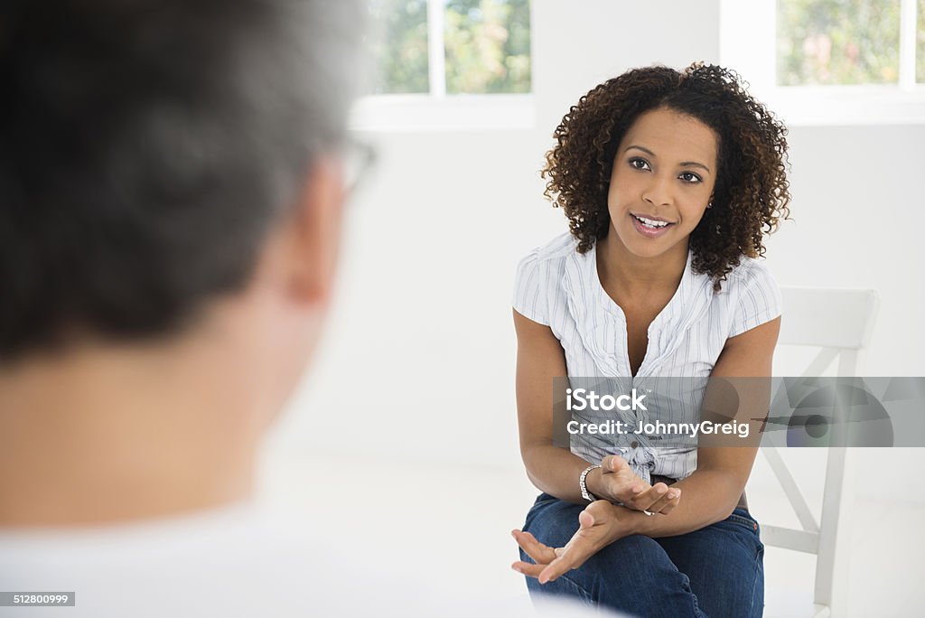 Woman talking at interview Woman talking at an interview or counselling session. Interview - Event Stock Photo