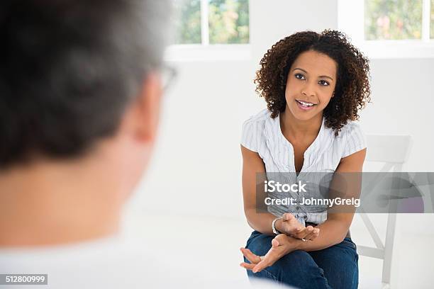 Woman Talking At Interview Stock Photo - Download Image Now - Interview - Event, Relaxation, Casual Clothing